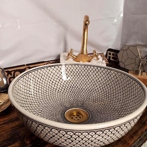 Lavabo marroquí de cerámica de lujo en blanco y negro, redondo y pintado a mano.