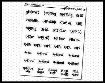 May include: A sheet of white paper with black script text stickers. The stickers have words like "groceries", "laundry", "shopping", "road", "errands", "important", "sleep in", "bath", "payday", "clean", "self care", "tired af", "coffee", "day off", "me time", "take out", "work", "workout", "planner time", "date night", "family time", "binge watch", and "plan w/me".