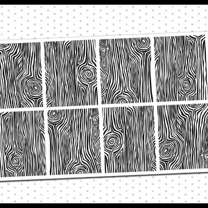 May include: A sheet of 8 black and white wood grain patterned stickers. The stickers are designed for use as planner or journal embellishments. The text "planner pixie co." and "DIY UNDERLAY" are printed on the sheet.