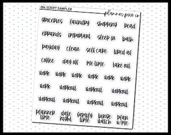 May include: A sheet of black and white script stickers with various words and phrases, including "groceries", "laundry", "shopping", "read", "payday", "clean", "self care", "tiped af", "coffee", "day off", "me time", "take out", "work", "workout", "planner time", "date night", "family time", "binge watch", and "plan w/me".