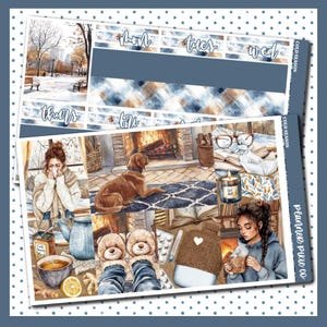 May include: A planner sticker sheet with a winter theme. The design features illustrations of a cozy indoor scene with a fireplace, a dog, and a person drinking tea. The top section has weekday labels and a blue plaid pattern.