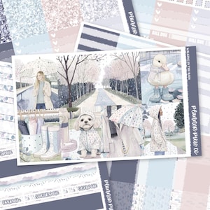 May include: A sticker sheet titled WALKING IN THE RAIN by Planner Pixie Co. featuring watercolor illustrations of a person with an umbrella, a duck in boots, a dog in a raincoat, and rainy park scenes in soft blue, pink, and grey tones.