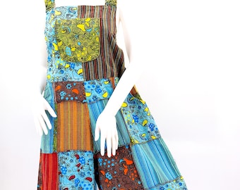 May include: Patchwork jumpsuit with a blue, green, red, and brown color scheme. The jumpsuit has a wide leg and a relaxed fit.
