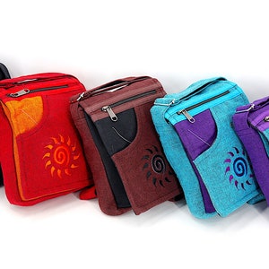 May include: Six different colored canvas crossbody bags with a sun design. The bags are all the same size and shape, and they have a zipper closure. The bags are made of a durable canvas material and are perfect for everyday use.