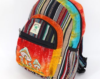May include: Multicolored striped hemp backpack with a front pocket featuring a mushroom design. The backpack has a label that reads "Himalayan Hemp Eco-Friendly Made in Nepal".