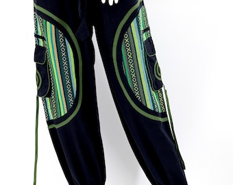 May include: Black pants with green and blue patterned fabric on the sides. The fabric has a geometric design. The pants have a drawstring waist and a loose fit.