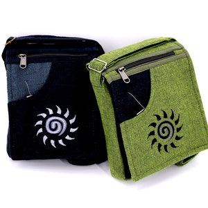 May include: Two canvas shoulder bags with a zippered closure and a pocket on the front. One bag is black with a white sun design and the other is green with a black sun design.