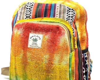 May include: A tie-dye hemp backpack with a colorful woven pattern on the bottom and sides. The backpack has a zippered pocket on the front and a label that reads "Himalayan Hemp THC Free Made in Nepal".