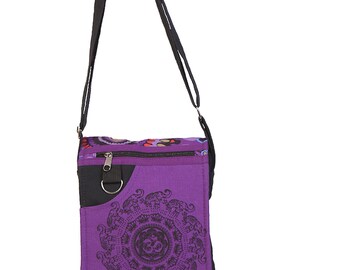 May include: Purple canvas shoulder bag with a black strap and a mandala design featuring elephants. The bag has a zipper closure and a small pocket on the front.