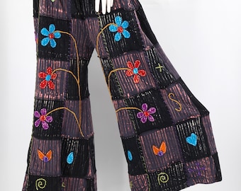Pantalones palazzo de pierna ancha con patchwork de algodón y bordado floral.