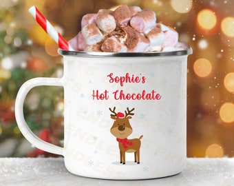 May include: White enamel mug with a red and white reindeer design. The mug says "Sophie's Hot Chocolate" and has a red and white striped straw.