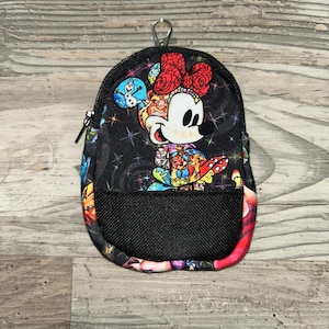 May include: A small black zipped pouch featuring a colourful graphic of Minnie Mouse wearing a red bow, surrounded by various Disney character illustrations and a star-patterned background. The pouch includes a black mesh front pocket and a metal clip.