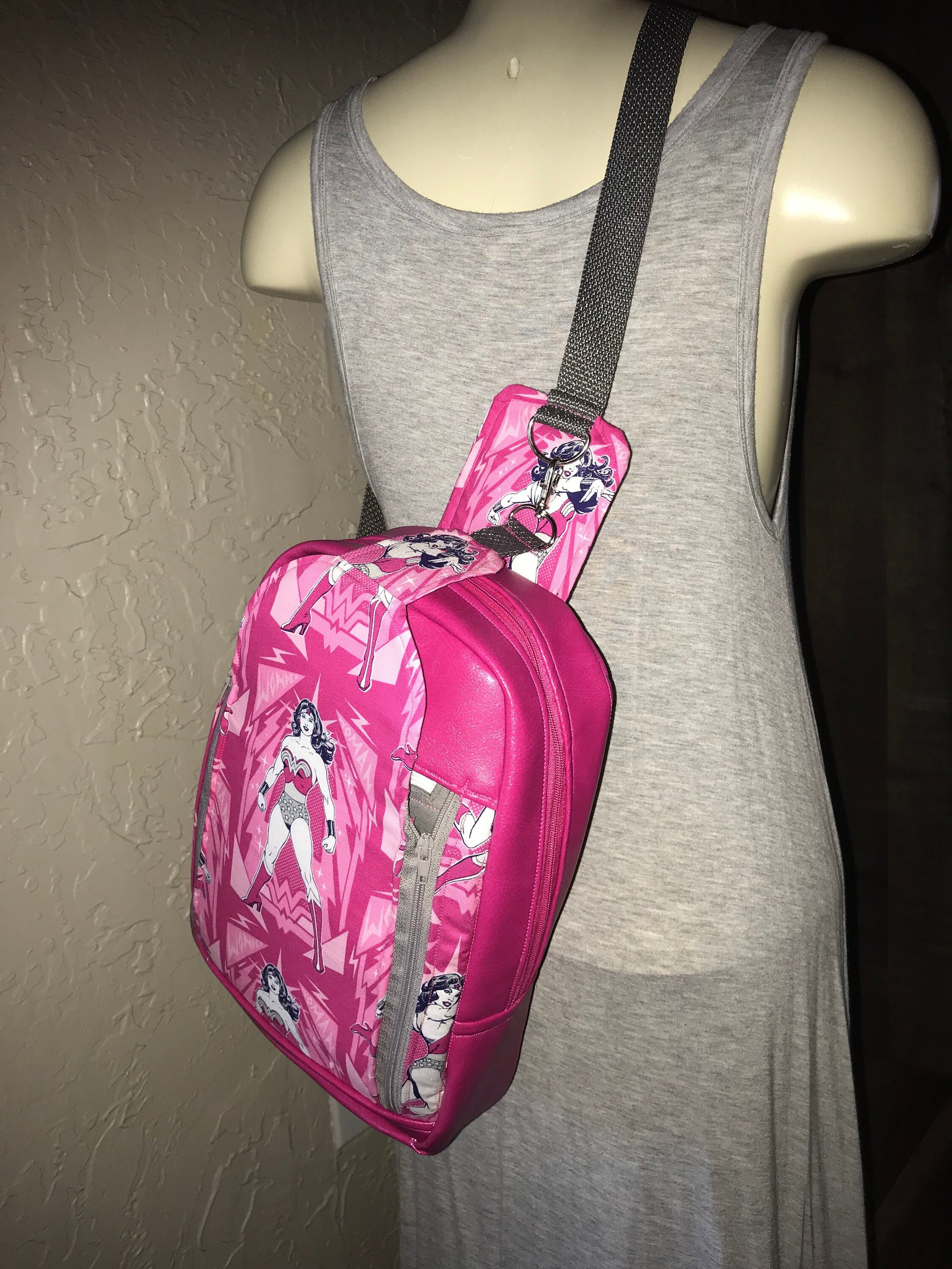 Pink sling backpack sales