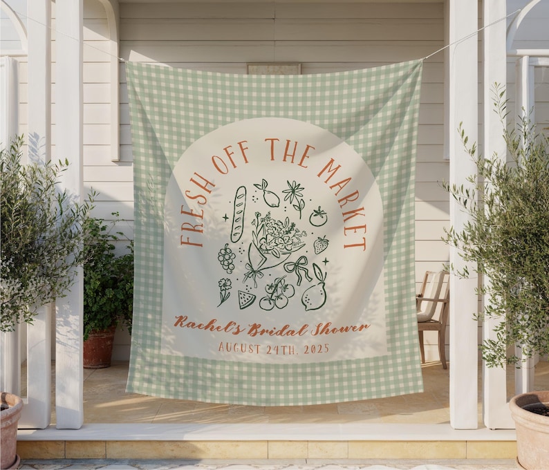 May include: A light green and white gingham banner with the text "FRESH OFF THE MARKET" in a semi-circle. Below the text is a bouquet of flowers and other illustrations. The banner reads "Rachel's Bridal Shower August 24th, 2025."