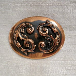 Burnished Copper Oval Brooch with High Relief Scroll Motif. Vintage 60&#39;s.