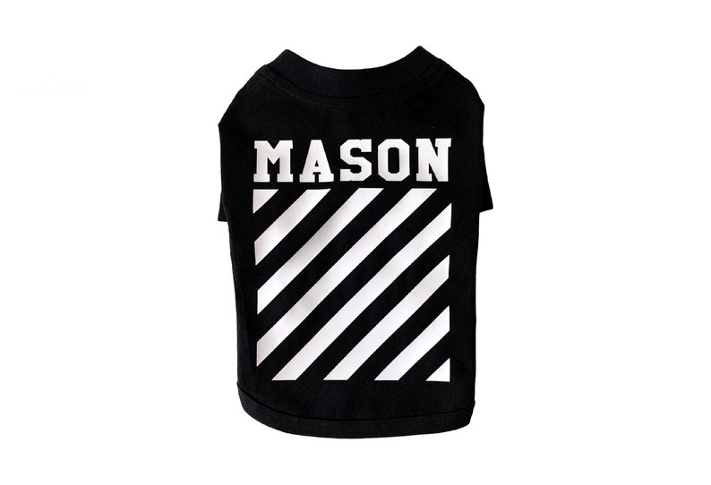 May include: Black dog t-shirt with white diagonal stripes and the name "MASON" printed in white.