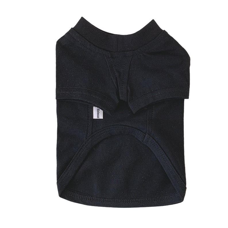 May include: Black dog t-shirt with a white "Harness" label.