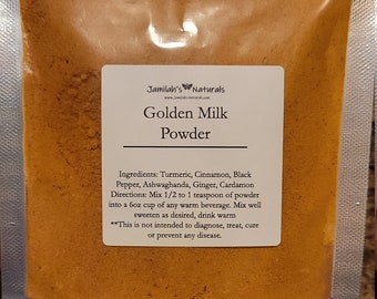 May include: A clear, sealed pouch filled with golden-yellow powder, labeled "Golden Milk Powder" by Jamilah's Naturals. The label lists ingredients like turmeric and cinnamon. The pouch is filled with a fine powder.