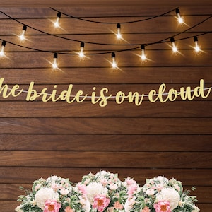 the bride is on cloud 9 banner, cloud 9 bridal shower themed decorations, bachelorette or engagement party banner, cloud party theme