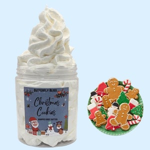 May include: A white whipped body butter in a clear jar with a blue and white label that says "Butterfly Bliss Christmas Cookies Whipped Body Butter 8 oz". The jar is surrounded by a white background. The label features a cartoon Santa Claus, snowman, and reindeer.