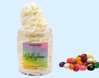 May include: A clear jar filled with a white whipped body butter. The jar has a label that says "Butterfly Bliss Jellybean Whipped Body Butter 8 oz". There are colorful jellybeans scattered on a light blue background.