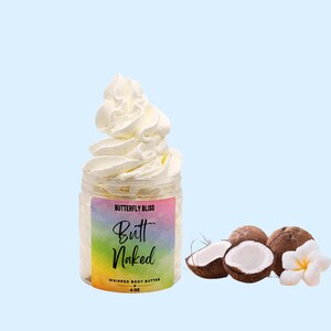 May include: A clear jar of whipped body butter with the text "Butterfly Bliss Butt Naked" and a whipped cream-like topping. The jar is next to several coconuts and a white flower on a light blue background.