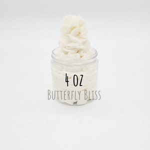 May include: A clear glass jar filled with white whipped body butter. The jar has a label that reads "4 oz BUTTERFLY BLISS".