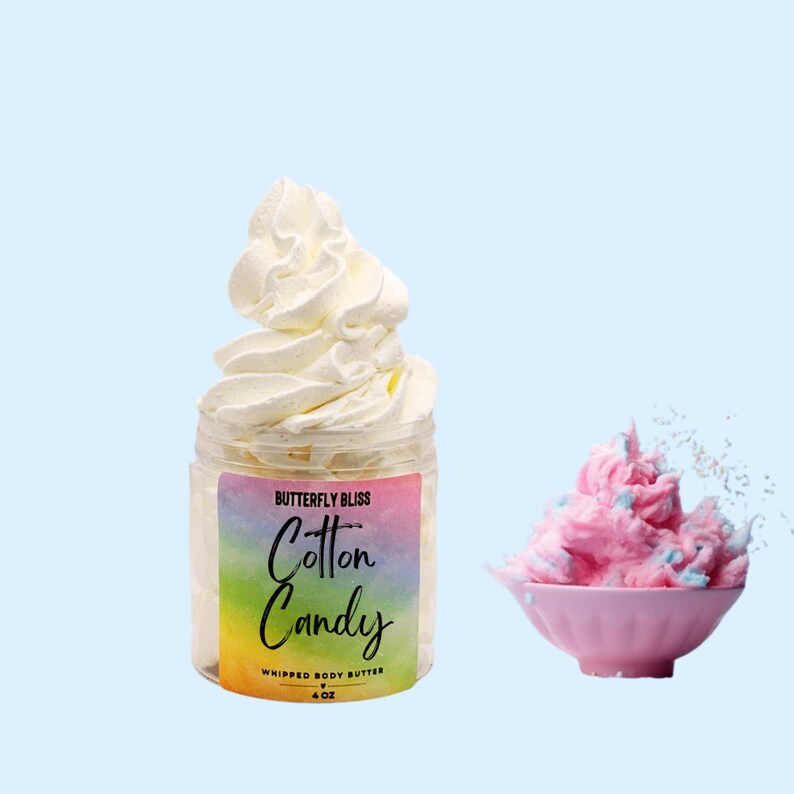 May include: A jar of whipped body butter with a rainbow gradient label that reads "Butterfly Bliss Cotton Candy Whipped Body Butter 4 oz". The jar is filled with a white whipped cream-like product. A pink whipped cream-like product is shown in a pink bowl.