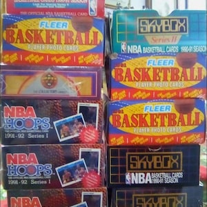 100+ vintage ongeopende NBA-basketbalkaarten in verpakkingen