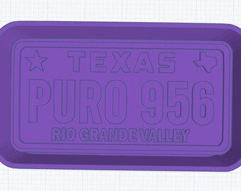 May include: Purple plastic tray with a raised design of a Texas license plate. The plate reads "TEXAS PURO 956 RIO GRANDE VALLEY".