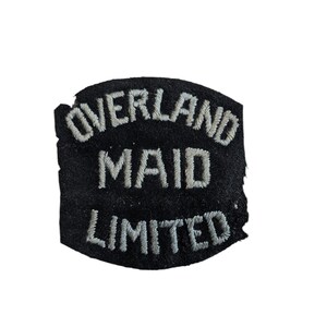 May include: Black fabric patch with white embroidered text that reads "Overland Maid Limited".