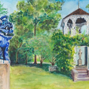 May include: A watercolor painting of a blue ceramic lion statue in front of a white gazebo with a brown roof. The gazebo is surrounded by green trees and bushes. There is a small statue of a person inside the gazebo.