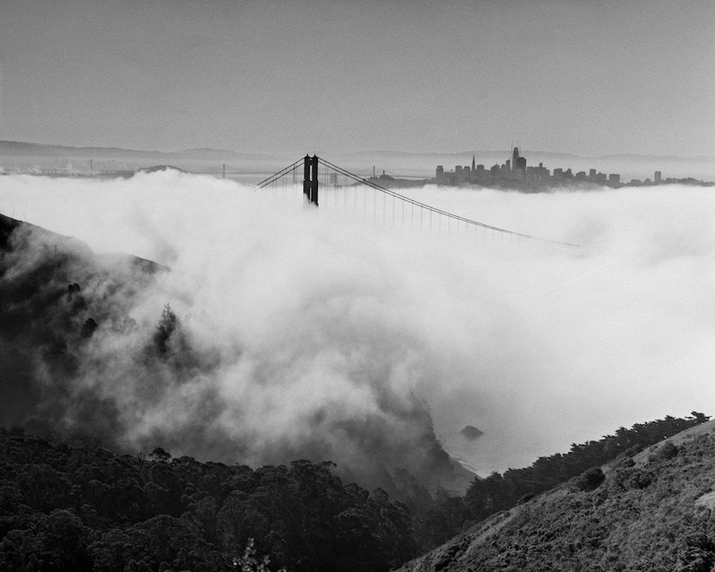Black and white photograph of the Golden Gate Bridge sinking into fog, shot on 4x5 film