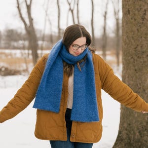 May include: A set of three ceramic mugs with a speckled, matte finish. The mugs are in shades of cream, light gray, and dark gray. Each mug has a simple, minimalist design, perfect for coffee or tea.