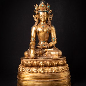 Stara brązowa nepalska koronowana statua Buddy z Nepalu, połowa XX wieku