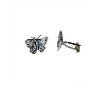 May include: A pair of silver butterfly cufflinks. The cufflinks are detailed with a textured butterfly design.