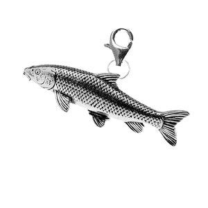 May include: A silver charm in the shape of a fish with a detailed design. The charm has a lobster clasp for attaching to a bracelet or necklace.