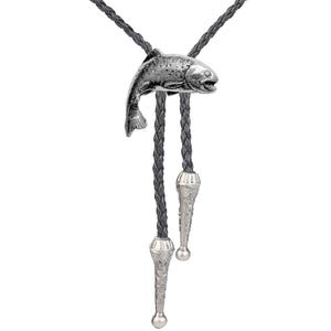 May include: A silver bolo tie featuring a detailed trout design. The tie has a black braided cord and silver tips.