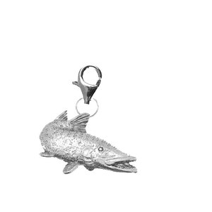 May include: A silver charm in the shape of a fish with a textured surface. The charm has a lobster clasp.