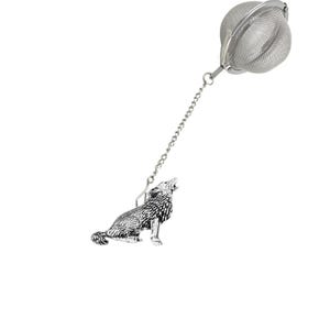 May include: Silver tea infuser with a wolf design and a mesh ball for loose tea.