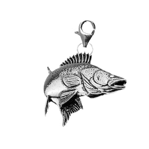 May include: A silver-coloured fish charm with a textured surface and a clasp. The fish has fins, scales, and a detailed head. Suitable for jewellery making or as a decorative element.