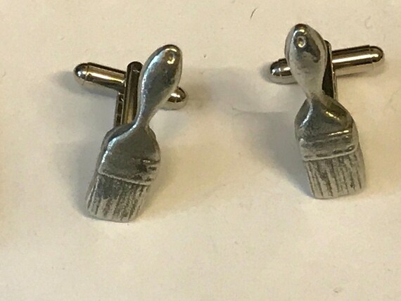 Paint Tin and Brush Cufflinks A great pair of cufflinks or Tie Clip as shown in the image The perfect Gift for some one special. Paint Tin and Brush Cufflinks A great pair of cufflinks or Tie Clip as shown in the image The perfect Gift for some one special.