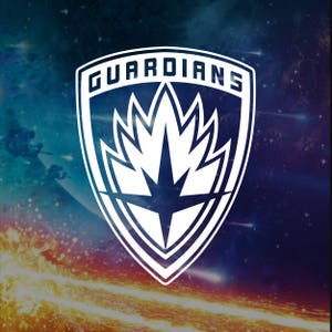 May include: A white and blue shield with the word "GUARDIANS" in white lettering. The shield features a white star with a flame-like design behind it.