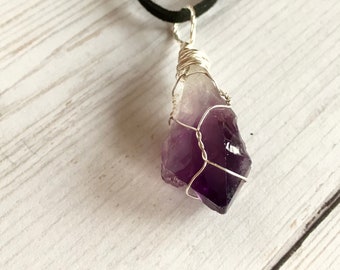 Sterling silver wrapped natural amethyst crystal pendant, complete with neck cord