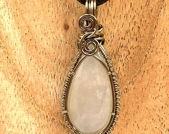 White Teardrop Moonstone wrapped in gunmetal enamelled copper wire, complete with black neck cord