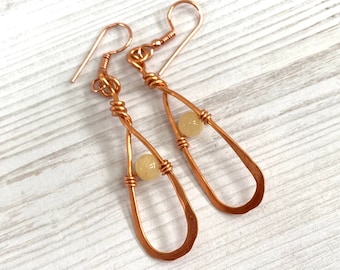 Hand forged copper drop earrings with yellow jade gemstones