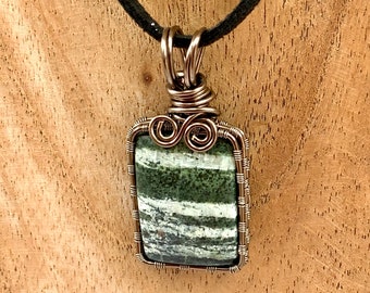 Square Swiss Green Opal cabochon, wrapped in gunmetal enamelled copper wire, complete with neck cord