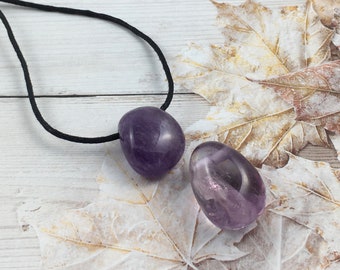 Amethyst crystal unisex pendants complete with black neck cord