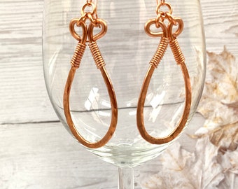 Hand forged copper earrings with spiral detail