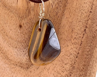 Golden Tigers Eye tumble-stone pendant on a sterling silver nail with black neck cord